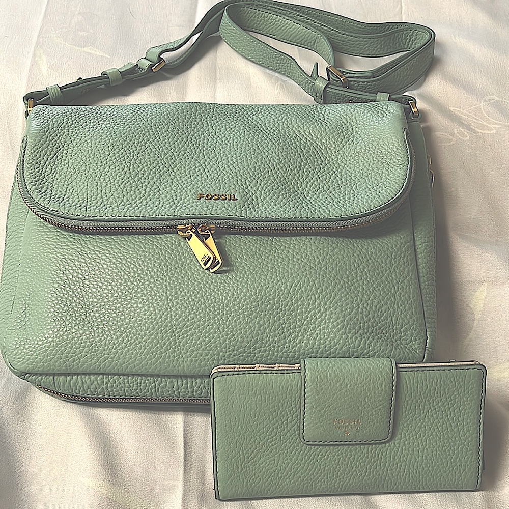 Fossil seafoam leather handbag with matching wallet.